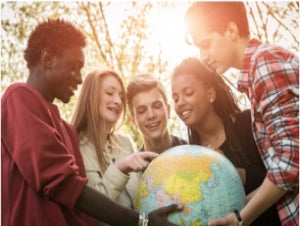 teens-in-a-group-looking-at-a-globe